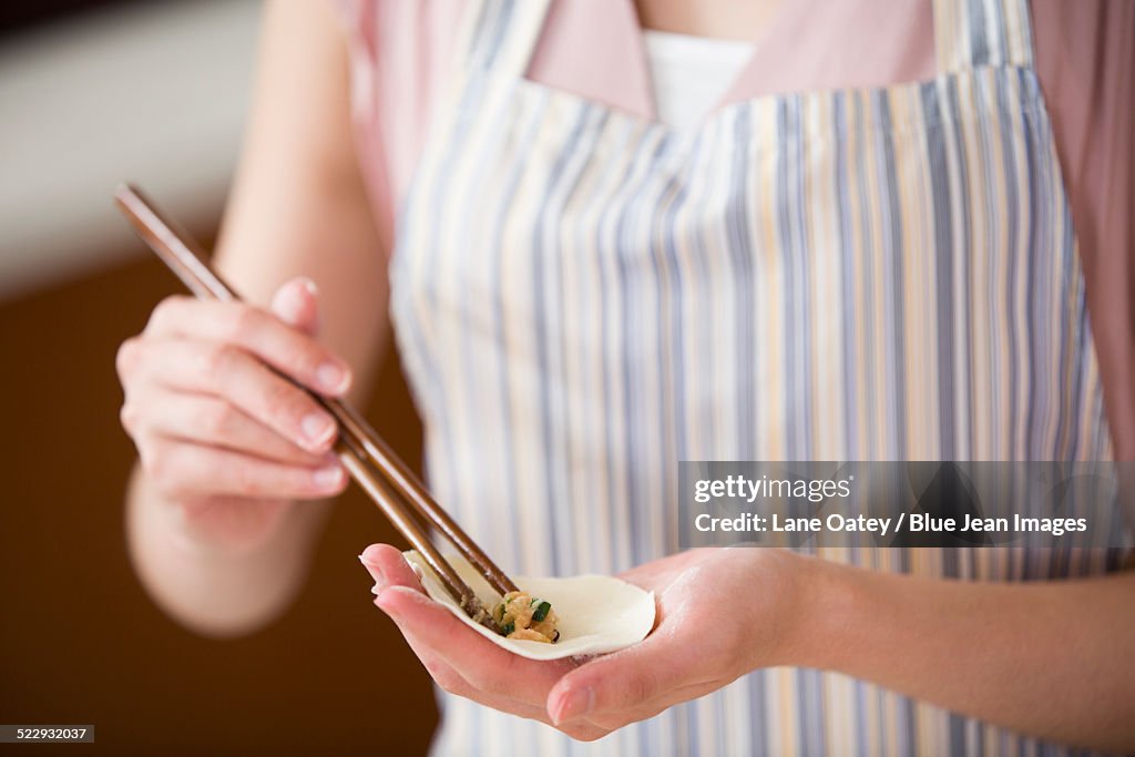 Woman making dumplings