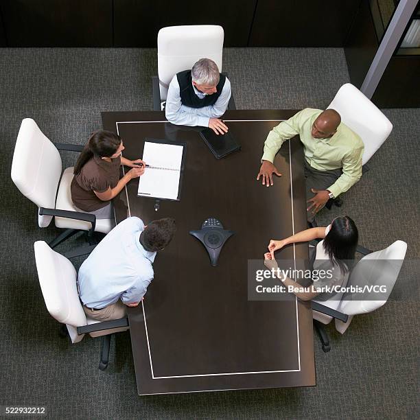 businesspeople in teleconference - conference phone stock pictures, royalty-free photos & images