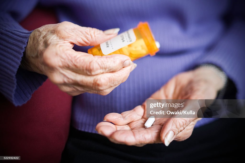 Senior Woman Taking Prescription