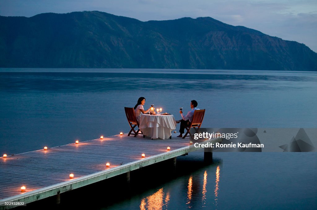 Couple Having Romantic Dinner Date on Pier