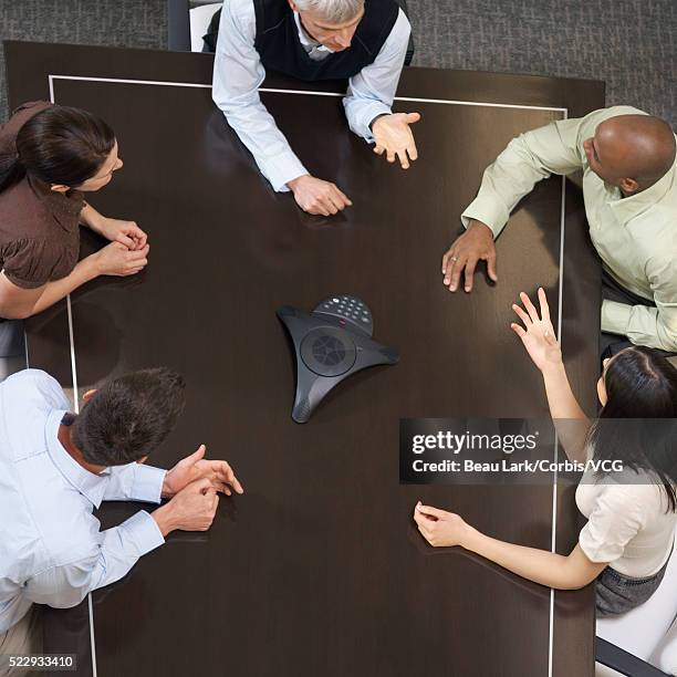 businesspeople teleconferencing - conference phone stock pictures, royalty-free photos & images