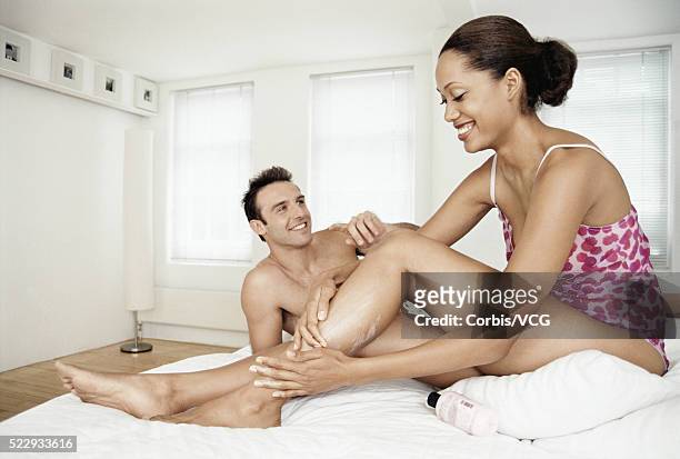 couple relaxing at home - bettmann corbis stock-fotos und bilder
