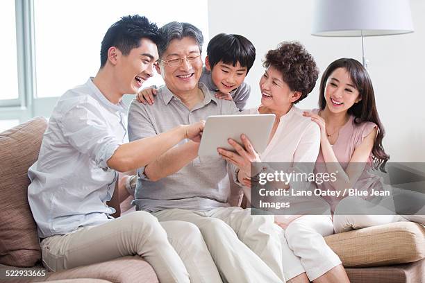 happy family with digital tablet - neat video stock pictures, royalty-free photos & images