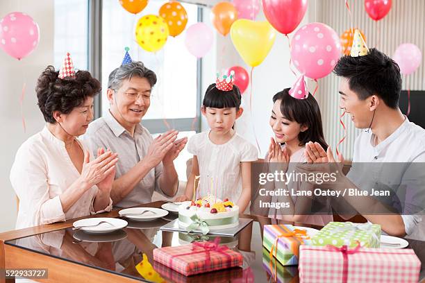 happy family celebrating birthday - light vivid children senior young focus stock pictures, royalty-free photos & images