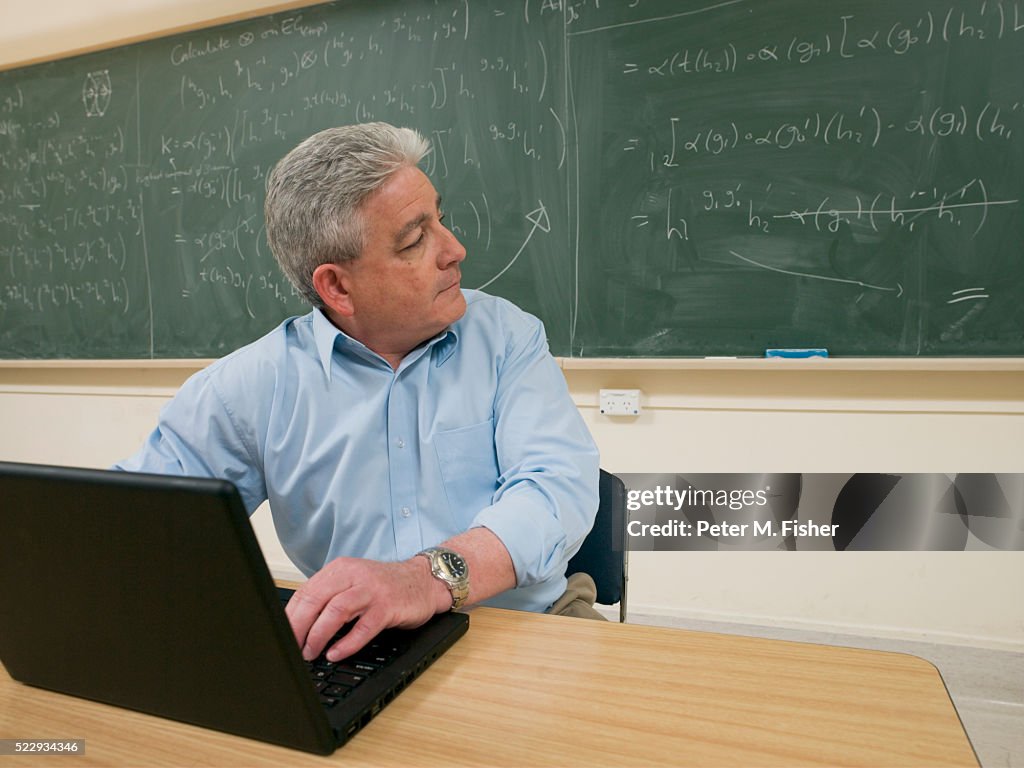 Mathematician Working in Classroom