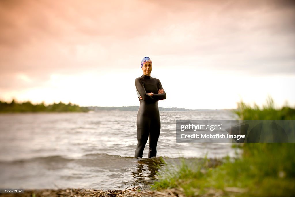 Swimmer Standing on Lakeshore