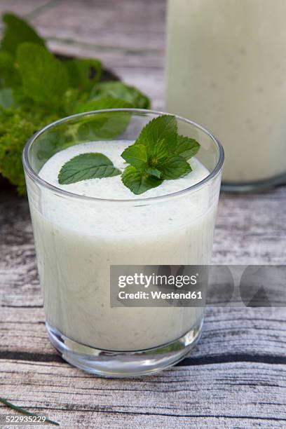 herbal lassi with bio yogurt and different herbs - lassi stock pictures, royalty-free photos & images