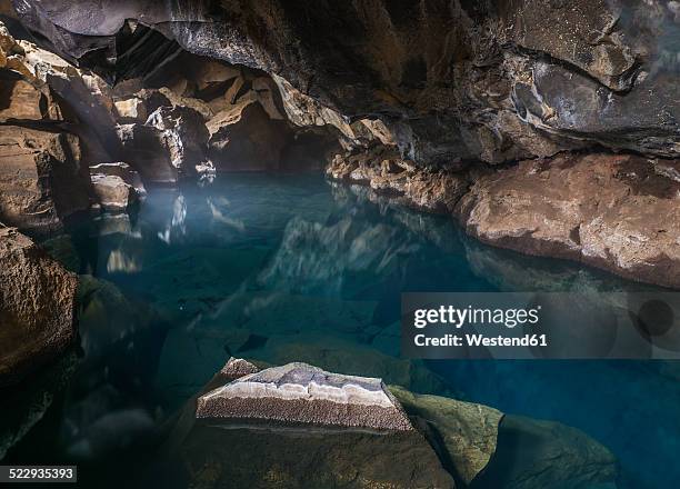 iceland, myvatn, grotagja, grotto - grotte stock-fotos und bilder