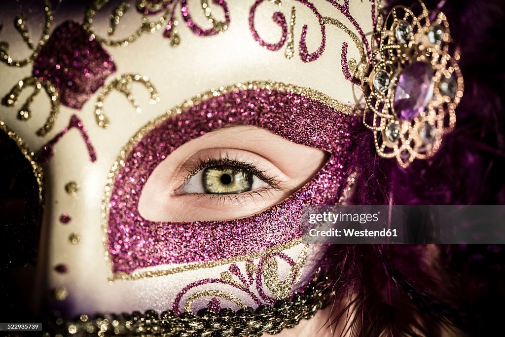 Germany, Girl wearing Venecian carnival mask