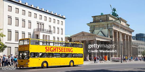 germany, berlin, view to brandenburg gate and place of march 18 with tour bus in the foreground - double decker bus stock pictures, royalty-free photos & images