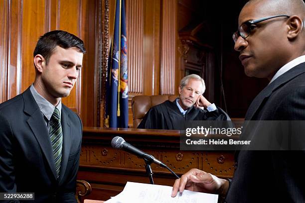 witness giving testimony during trial - court judge stock pictures, royalty-free photos & images