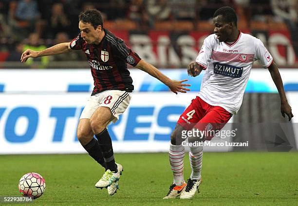 Giacomo Bonaventura of AC Milan is challenged by Isaac Cofie of Carpi FC during the Serie A match between AC Milan and Carpi FC at Stadio Giuseppe...