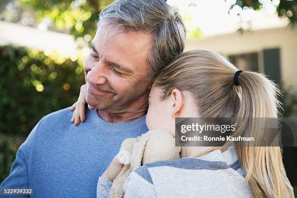 father and daughter hugging - father daughter stock pictures, royalty-free photos & images