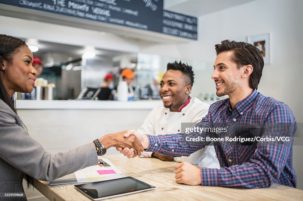 Financial planner talking with small business owners