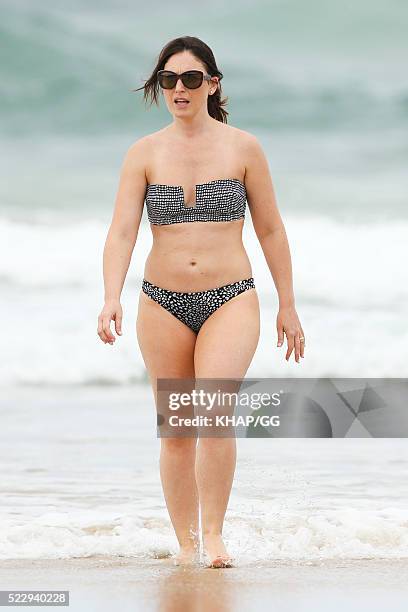 Glenn and Sara McGrath pictured enjoying a beach outing with their family on April 18, 2016 in Byron Bay, Australia.