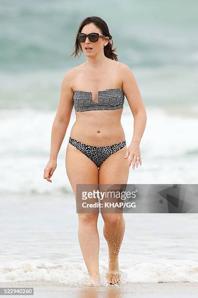 Glenn and Sara McGrath pictured enjoying a beach outing with their family on April 18, 2016 in Byron Bay, Australia.