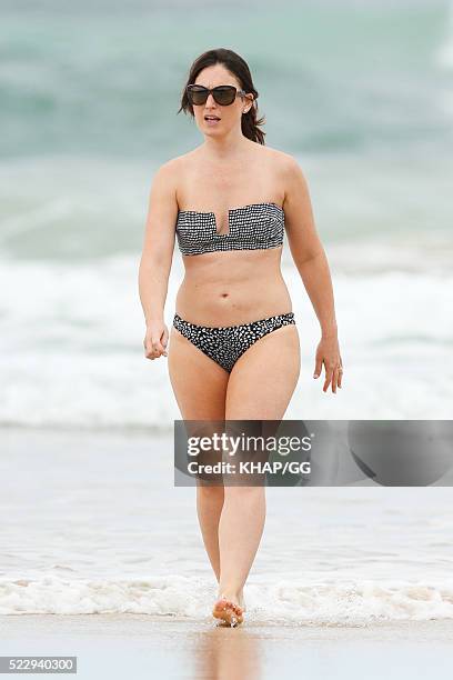 Glenn and Sara McGrath pictured enjoying a beach outing with their family on April 18, 2016 in Byron Bay, Australia.