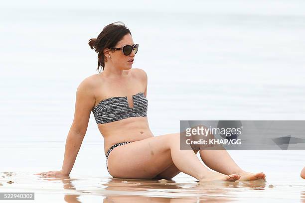 Glenn and Sara McGrath pictured enjoying a beach outing with their family on April 18, 2016 in Byron Bay, Australia.