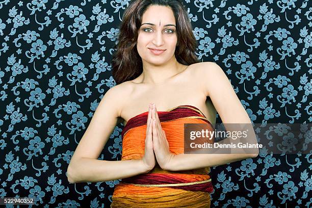 indian woman with hands in namaste - 合掌 ストックフォトと画像