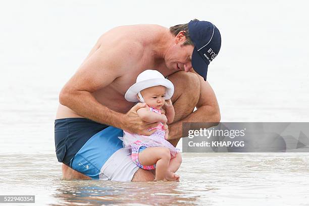 Glenn and Sara McGrath pictured enjoying a beach outing with their family on April 18, 2016 in Byron Bay, Australia.