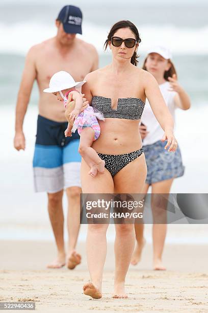 Glenn and Sara McGrath pictured enjoying a beach outing with their family on April 18, 2016 in Byron Bay, Australia.