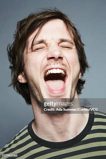 young man with mouth open - man open mouth stock pictures, royalty-free photos & images