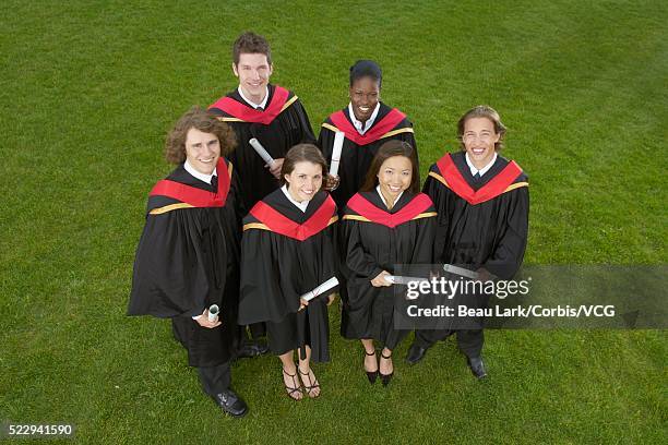 graduates - paper gown stock pictures, royalty-free photos & images