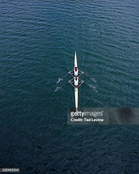 two men rowing - rowboat stockfoto's en -beelden