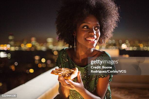 woman enjoying rooftop party - new york food stockfoto's en -beelden