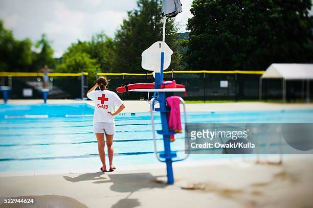 lifeguard poolside - lifeguard stock pictures, royalty-free photos & images