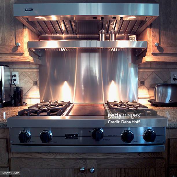 stainless steel stove and hood - stove top stock-fotos und bilder