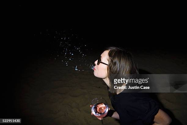 woman spitting out liquid - saliva stock pictures, royalty-free photos & images