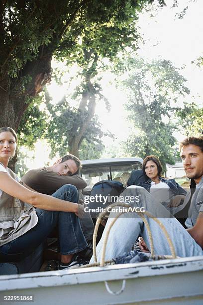 hitchhikers in the back of a truck - hitchhiking stock pictures, royalty-free photos & images