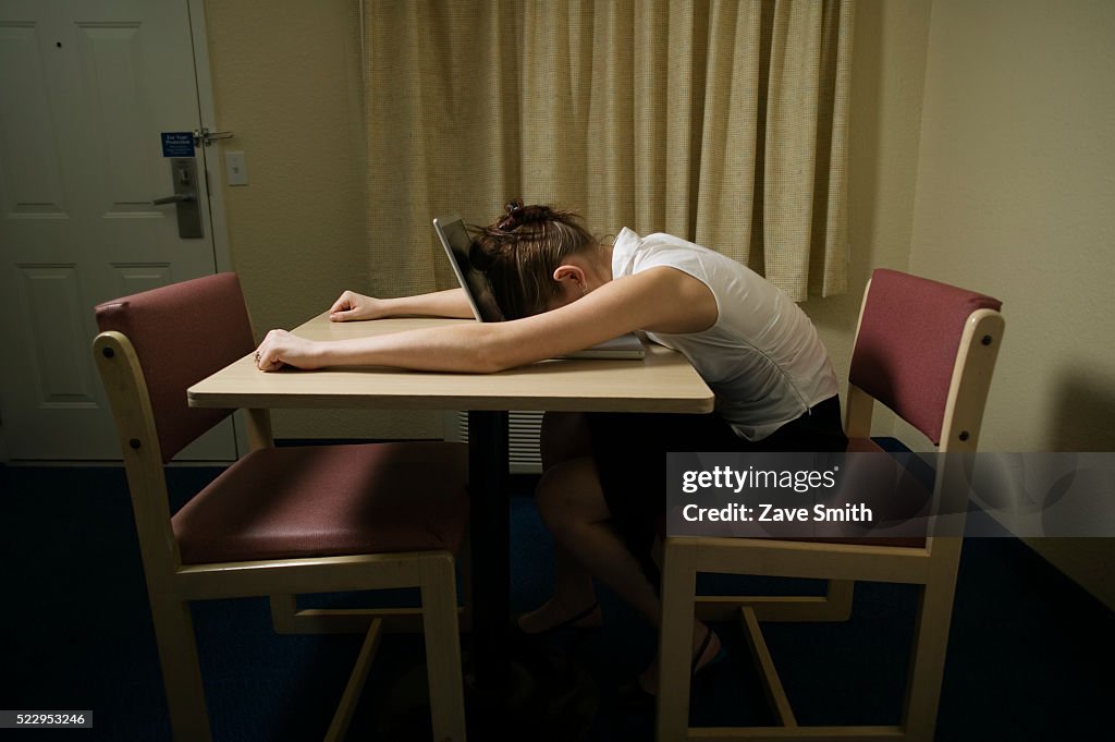 Young Woman Asleep on Laptop