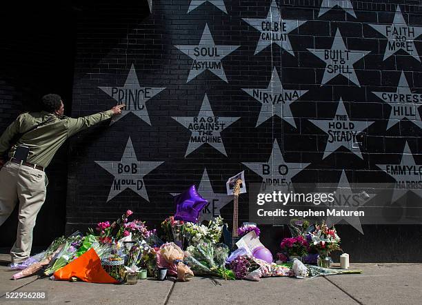 Man touches the Prince star on the wall outside the First Avenue nightclub on April 21, 2016 in Minneapolis, Minnesota. Prince died earlier today at...