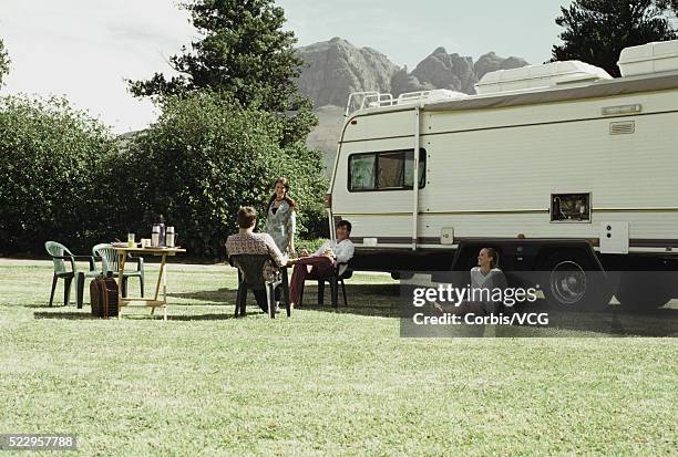 group of friends by motor home - archival camping stock pictures, royalty-free photos & images