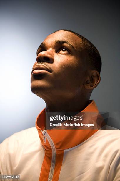 young man looking up - black man looking up stock pictures, royalty-free photos & images