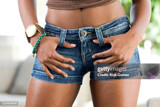 midriff of woman - hot pants stock pictures, royalty-free photos & images