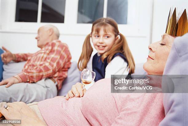 girl watching her grandmother sleep - drunk wife at party stockfoto's en -beelden