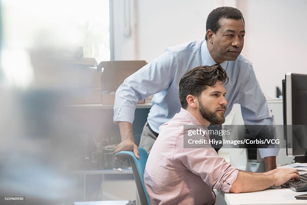 Office Worker And Manager Looking At Computer Screen High-Res Stock ...