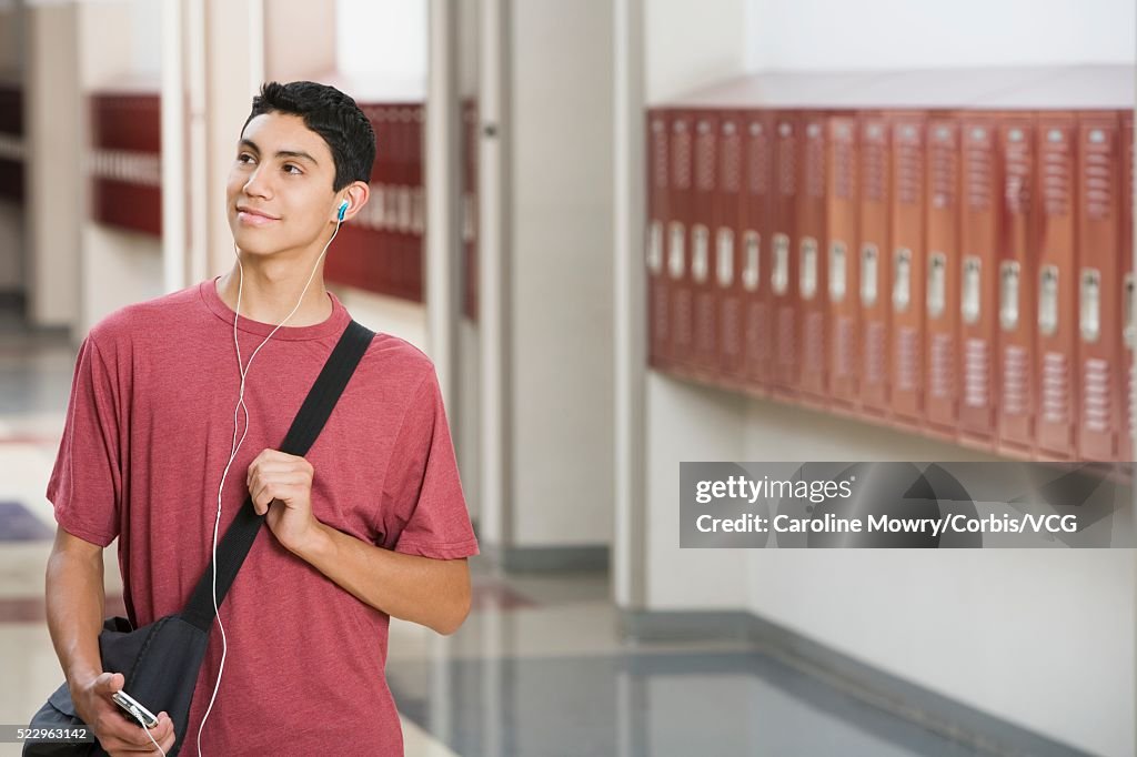 High School Student Listening to Mp3 Player