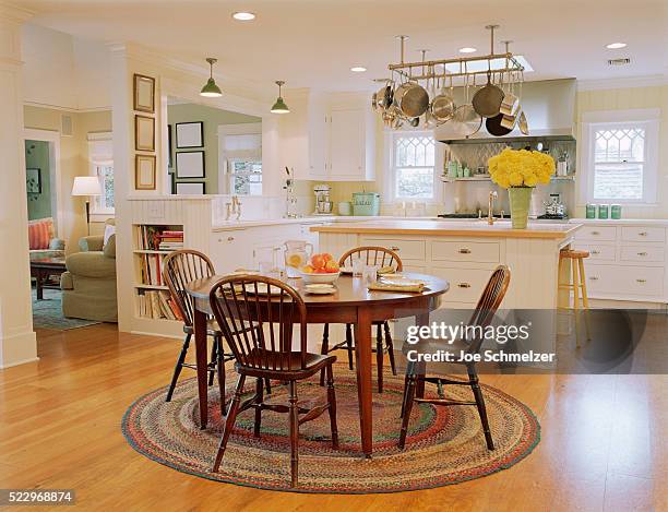 wooden table and chairs in traditional kitchen - esstisch stock-fotos und bilder