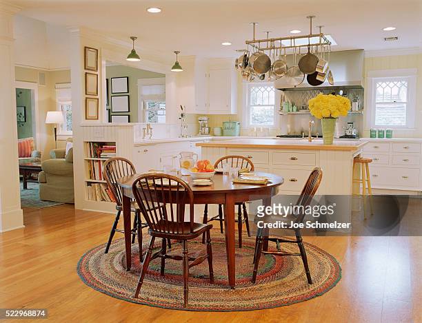 wooden table and chairs in traditional kitchen - dining table stock pictures, royalty-free photos & images