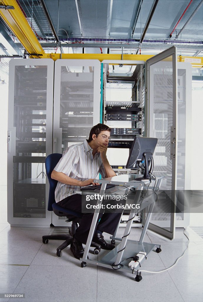 It Worker Using Computer In Server Room High-Res Stock Photo - Getty Images
