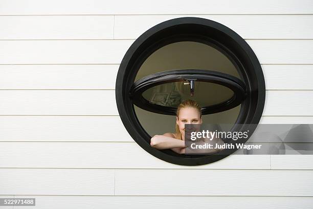 woman looking out of window - weatherboard stock pictures, royalty-free photos & images