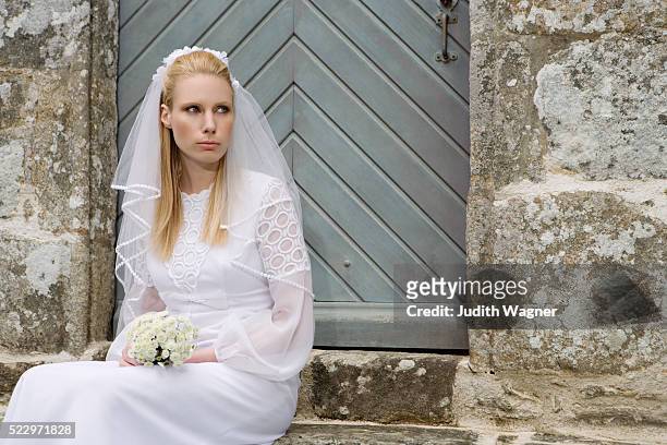bride waiting outside chapel - nervous bride stock pictures, royalty-free photos & images