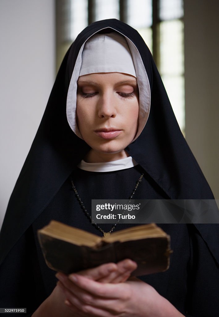 Nun Reading Bible
