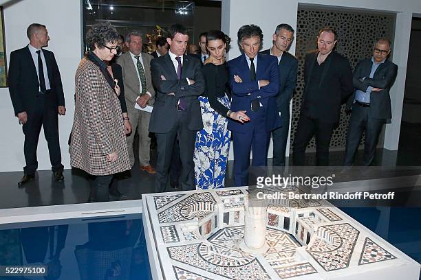 Exhibition Curator Nathalie Sultan, French Prime Minister Manuel Valls, Exhibition Curator Agnes Carayon and President of the 'Institut du Monde...