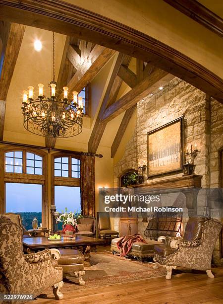 stone fireplace in living room - arched stone fireplace stock pictures, royalty-free photos & images
