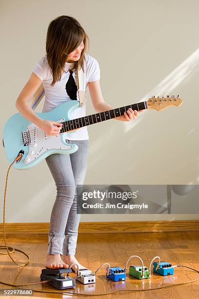 pre-teen girl playing guitar - jim craigmyle guitar stock pictures, royalty-free photos & images